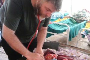 niall-examining-newborn-twins-in-a-tent-at-tushili-hospital1