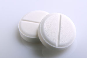 two white pills on a table