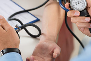 Doctor Measures Pressure In The Patient