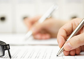 Business partners are signing contract after successful meeting