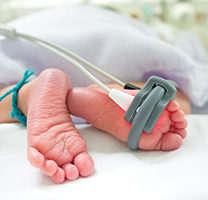 Baby feet and oxygen monitor