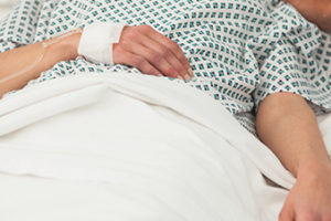 Old lady lying sick in bed