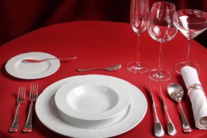 Professional setting of red dinner table
