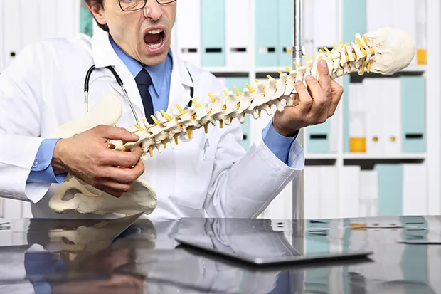 crazy doctor with the spine skeleton