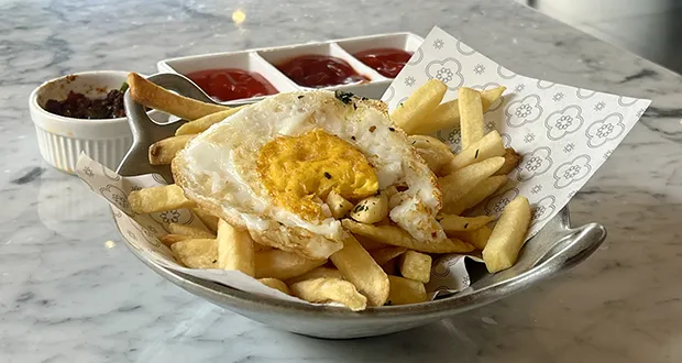Halving consumption of ultra-processed foods could save thousands of lives - study